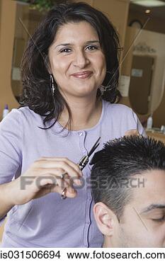 Stock Photo - hispanic female 
hairstylist cutting 
hair. fotosearch 
- search stock 
photos, pictures, 
images, and photo 
clipart