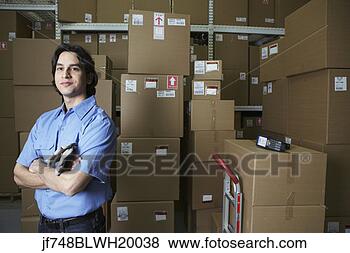 Stock Photo - hispanic male 
warehouse worker 
with boxes. fotosearch 
- search stock 
photos, pictures, 
images, and photo 
clipart