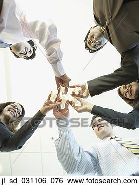 Stock Photo - low angle view 
of coworkers toasting. 
fotosearch - search 
stock photos, 
pictures, images, 
and photo clipart