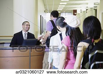 Picture - man sitting at 
reception desk 
with line of people. 
fotosearch - search 
stock photos, 
pictures, images, 
and photo clipart
