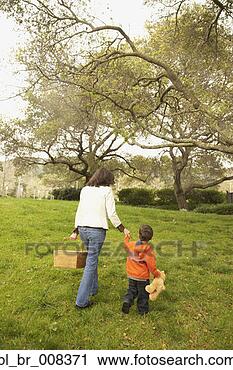 Stock Photography - mother and young 
son with picnic 
basket in park. 
fotosearch - search 
stock photos, 
pictures, images, 
and photo clipart