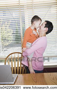 Stock Photography - pregnant mother 
and hugging young 
son. fotosearch 
- search stock 
photos, pictures, 
images, and photo 
clipart