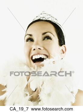 Picture - studio shot of 
woman wearing 
tiara and feather 
boa. fotosearch 
- search stock 
photos, pictures, 
images, and photo 
clipart