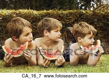 Picture - three brothers 
eating watermelon 
outdoors. fotosearch 
- search stock 
photos, pictures, 
images, and photo 
clipart