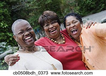 Stock Photo - three middle-aged 
african women 
smiling and hugging. 
fotosearch - search 
stock photos, 
pictures, images, 
and photo clipart
