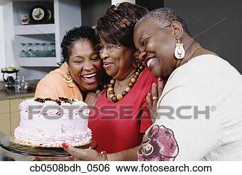 Stock Photo - three middle-aged 
african women 
holding cake. 
fotosearch - search 
stock photos, 
pictures, images, 
and photo clipart