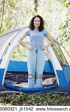 Stock Photo - woman standing 
next to tent. 
fotosearch - search 
stock photos, 
pictures, images, 
and photo clipart