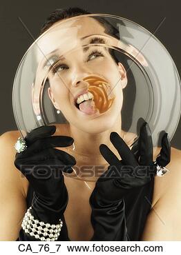 Picture - woman wearing 
gloves and jewels 
licking plate. 
fotosearch - search 
stock photos, 
pictures, images, 
and photo clipart