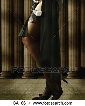 Picture - womanís legs with 
gun in stockings. 
fotosearch - search 
stock photos, 
pictures, images, 
and photo clipart