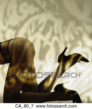 Picture - womanís legs with 
stockings and 
high heels. fotosearch 
- search stock 
photos, pictures, 
images, and photo 
clipart