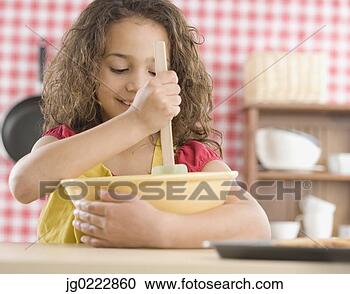 Stock Photography - young girl mixing 
batter in kitchen. 
fotosearch - search 
stock photos, 
pictures, images, 
and photo clipart