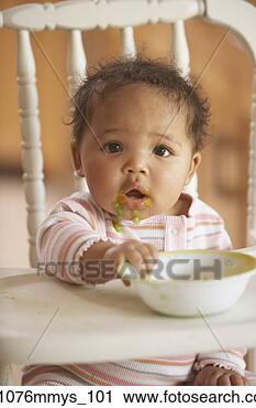 Stock Photography - african baby in 
highchair with 
food on face. 
fotosearch - search 
stock photos, 
pictures, images, 
and photo clipart