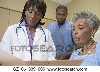 Stock Photo - african female 
doctor with co-workers. 
fotosearch - search 
stock photos, 
pictures, images, 
and photo clipart
