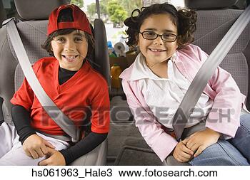 Stock Photo - brother and sister 
seat belted in 
back of car. fotosearch 
- search stock 
photos, pictures, 
images, and photo 
clipart