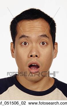 Stock Photo - close up studio 
shot of asian 
man looking surprised. 
fotosearch - search 
stock photos, 
pictures, images, 
and photo clipart