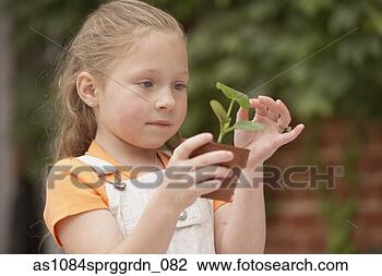 Stock Photo - girl touching 
small potted plant 
outdoors. fotosearch 
- search stock 
photos, pictures, 
images, and photo 
clipart