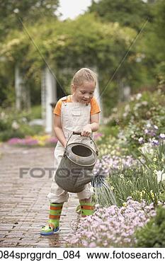 Stock Photo - girl using watering 
can in garden. 
fotosearch - search 
stock photos, 
pictures, images, 
and photo clipart