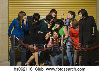 Stock Photography - group of young 
adults behind 
velvet rope. fotosearch 
- search stock 
photos, pictures, 
images, and photo 
clipart