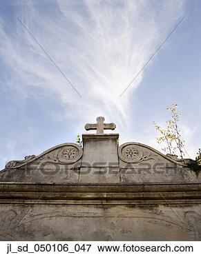 Picture - low angle view 
of stone cross 
under blue sky. 
fotosearch - search 
stock photos, 
pictures, images, 
and photo clipart