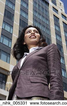 Stock Photography - low angle view 
of indian businesswoman 
in urban scene. 
fotosearch - search 
stock photos, 
pictures, images, 
and photo clipart
