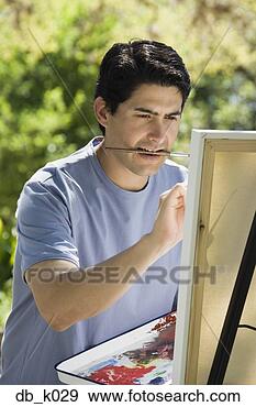Stock Photograph - man painting with 
easel outdoors. 
fotosearch - search 
stock photos, 
pictures, images, 
and photo clipart