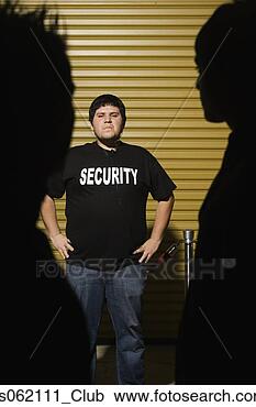 Stock Photography - man wearing security 
shirt with hands 
on hips. fotosearch 
- search stock 
photos, pictures, 
images, and photo 
clipart