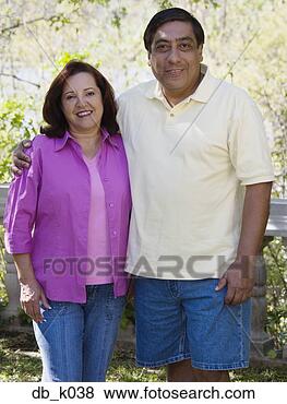 Stock Photo - middle-aged hispanic 
couple hugging 
outdoors. fotosearch 
- search stock 
photos, pictures, 
images, and photo 
clipart