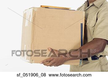 Stock Photo - studio shot of 
african delivery 
man with package. 
fotosearch - search 
stock photos, 
pictures, images, 
and photo clipart
