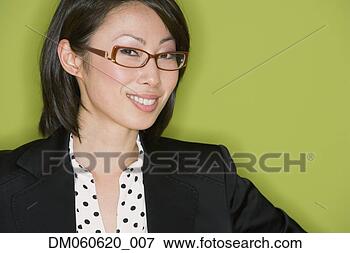 Picture - studio shot of 
asian businesswoman 
wearing eyeglasses. 
fotosearch - search 
stock photos, 
pictures, images, 
and photo clipart