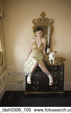 Stock Image - woman in fancy 
dress with small 
dog on dresser. 
fotosearch - search 
stock photos, 
pictures, images, 
and photo clipart