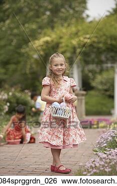 Stock Photo - young girl with 
easter basket 
in garden. fotosearch 
- search stock 
photos, pictures, 
images, and photo 
clipart