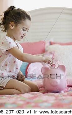 Stock Image - young girl putting 
money in piggy 
bank. fotosearch 
- search stock 
photos, pictures, 
images, and photo 
clipart