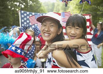 Stock Photography - asian mother and 
daughter in fourth 
of july parade. 
fotosearch - search 
stock photos, 
pictures, images, 
and photo clipart