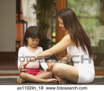 Stock Photo - asian mother teaching 
young daughter 
yoga. fotosearch 
- search stock 
photos, pictures, 
images, and photo 
clipart