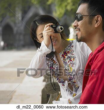 Stock Photography - asian woman talking 
photograph of 
asian man outdoors. 
fotosearch - search 
stock photos, 
pictures, images, 
and photo clipart
