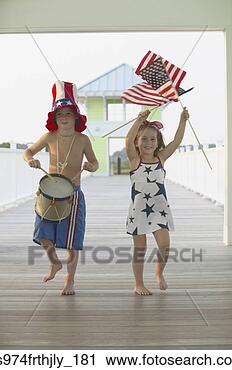 Stock Photography - boy and girl marching 
on fourth of july. 
fotosearch - search 
stock photos, 
pictures, images, 
and photo clipart