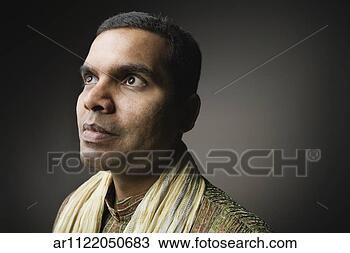 Stock Photo - close up of indian 
man looking up 
and to the side. 
fotosearch - search 
stock photos, 
pictures, images, 
and photo clipart