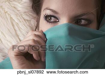 Stock Photo - close up of woman 
holding veil over 
lower half of 
face. fotosearch 
- search stock 
photos, pictures, 
images, and photo 
clipart