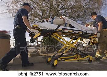 Stock Photography - emt workers with 
accident victim 
on gurney. fotosearch 
- search stock 
photos, pictures, 
images, and photo 
clipart