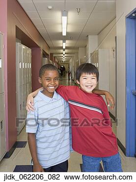 Stock Photo - girl giving thumbs  up with head down  on desk. fotosearch  - search stock  photos, pictures,  images, and photo  clipart