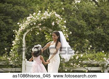Stock Image - hispanic bride 
and young girl 
dancing in circle. 
fotosearch - search 
stock photos, 
pictures, images, 
and photo clipart