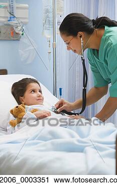 Stock Photography - hispanic female 
nurse using stethoscope 
on girl in hospital 
bed. fotosearch 
- search stock 
photos, pictures, 
images, and photo 
clipart