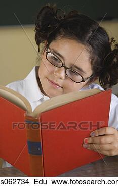 Stock Photo - hispanic girl 
wearing eye glasses 
and reading book. 
fotosearch - search 
stock photos, 
pictures, images, 
and photo clipart