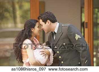 Picture - hispanic man in 
military uniform 
hugging wife and 
baby. fotosearch 
- search stock 
photos, pictures, 
images, and photo 
clipart