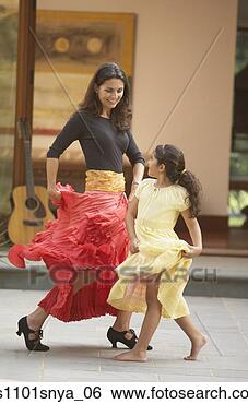 Stock Photo - hispanic mother 
and young daughter 
salsa dancing. 
fotosearch - search 
stock photos, 
pictures, images, 
and photo clipart