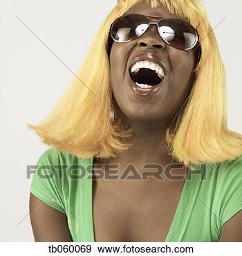Stock Photograph - studio shot of 
african woman 
wearing blonde 
wig and sunglasses. 
fotosearch - search 
stock photos, 
pictures, images, 
and photo clipart