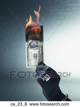 Stock Photo - woman's gloved 
and jeweled hand 
holding burning 
us hundred dollar 
bill. fotosearch 
- search stock 
photos, pictures, 
images, and photo 
clipart