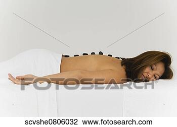 Stock Photo - asian woman receiving 
spa stone treatment. 
fotosearch - search 
stock photos, 
pictures, images, 
and photo clipart