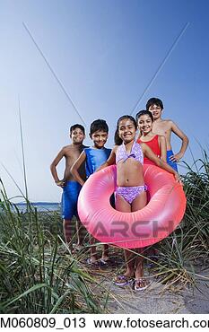 Stock Photo - hispanic children 
in bathing suits 
on beach. fotosearch 
- search stock 
photos, pictures, 
images, and photo 
clipart