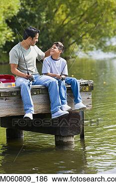 Stock Photo - hispanic father 
and son sitting 
on dock with fishing 
poles. fotosearch 
- search stock 
photos, pictures, 
images, and photo 
clipart
